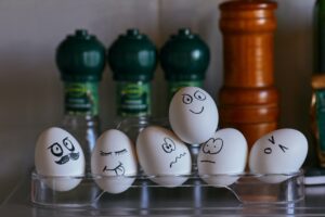 Eggs with Black Sharpie drawn emotions.