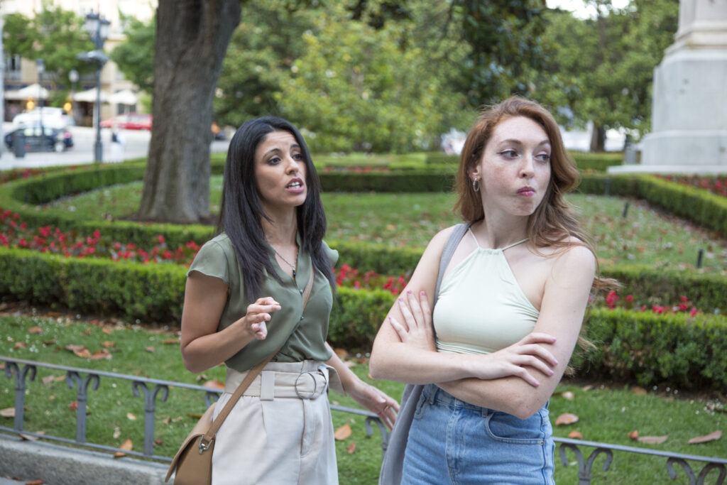Two women arguing outdoors